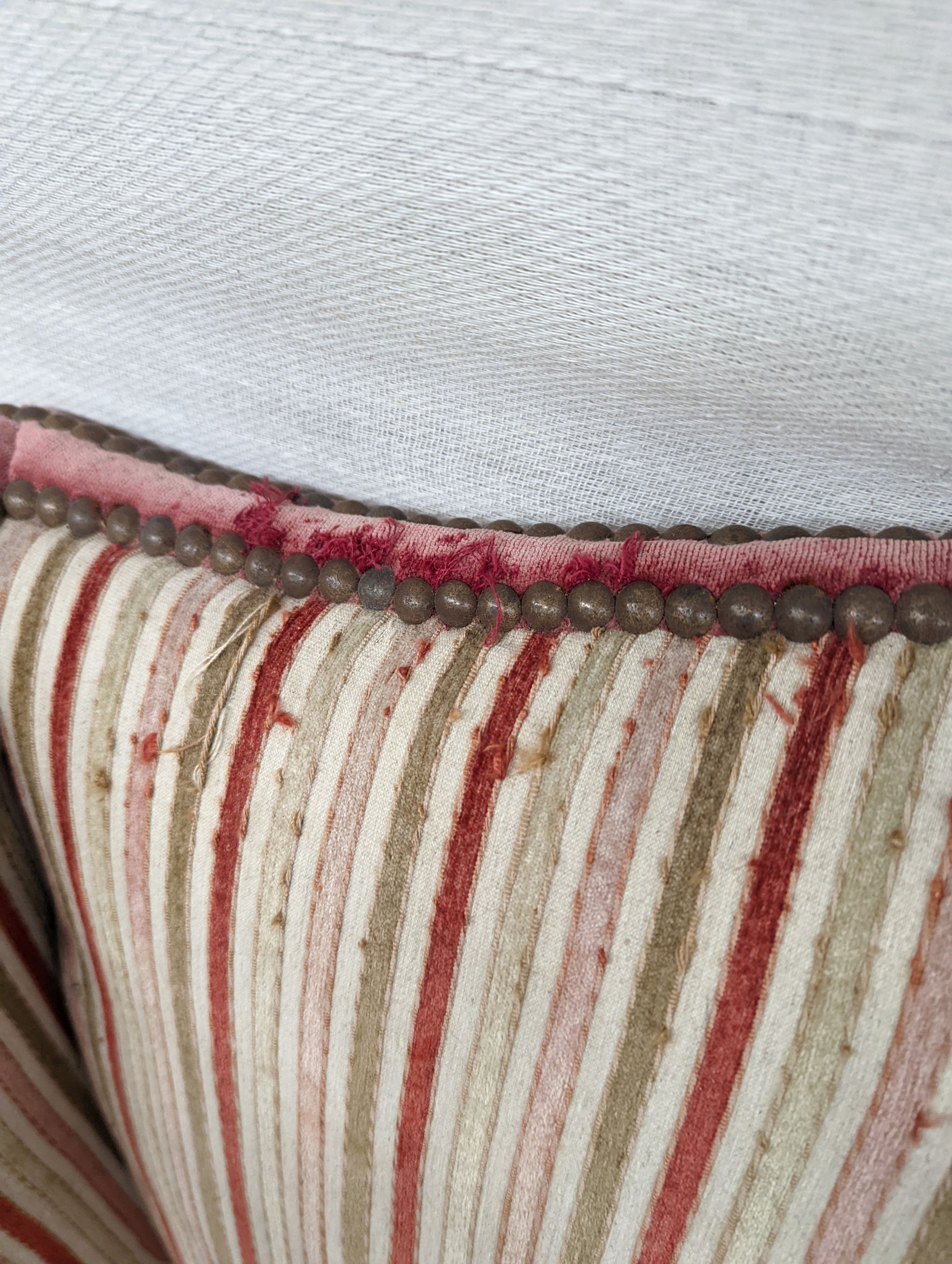 A 19th century Louis XVI style upholstered wing armchair, width 71cm, depth 74cm, height 104cm